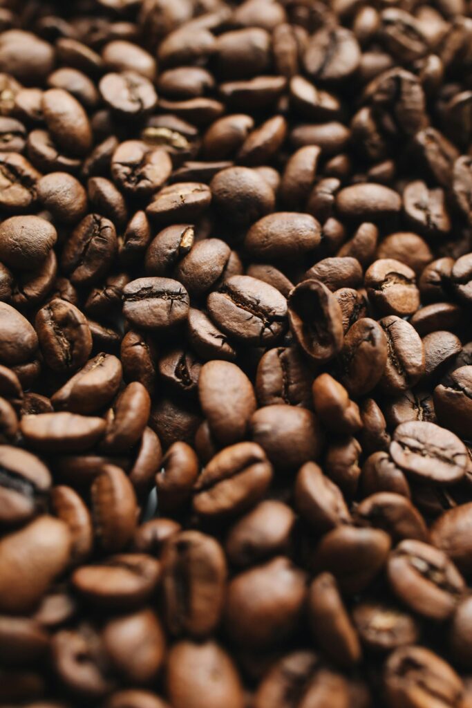 pexels photo 4109744 4109744 Close-up view of aromatic roasted coffee beans showcasing texture and richness.